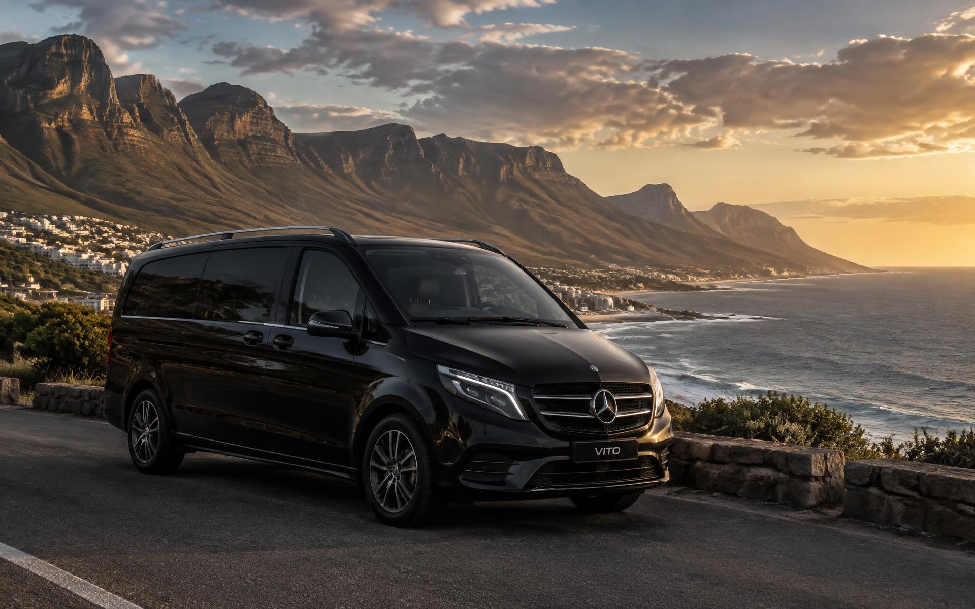 Private transfer vehicle parked on a coastal road overlooking the Atlantic near Cape Town